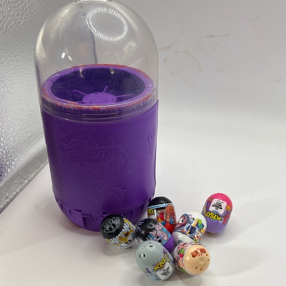 Mighty Beanz collection of 7 beans with purple storage canister